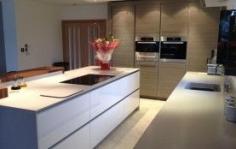 As part of a large room incorporating the kitchen, dining and living area we were commissioned to come up with a modern, eye-catching yet functional kitchen design.