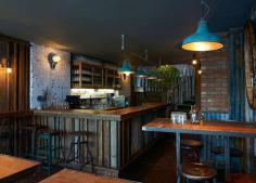 Interior designers Brinkworth have created a restaurant in central London that resembles a farm building, with rusty corrugated iron on the ...