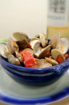 Grilled shellfish is a great way to enjoy fresh seafood in the summer without heating up the house. These Grilled Clams with Lemon Basil Com...