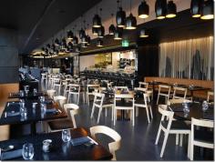 Fish scale, hanging ropes along the walls and windows are predominant motifs of a modernist decor in the main dining room of Sokyo, The Star, Sydney.