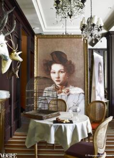 Oversized facsimiled portraits by impressionist painter Jean-Baptiste-Camille Corot, along with an old birdcage and antique wooden trophy heads, lend the gourmet restaurant within Les Etangs de Corot, a hotel near Paris, a quirky charm.