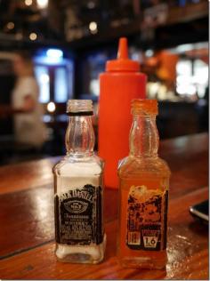 
                        
                            Salt and hot sauce at Mary's come in used miniature Jack Daniel’s whisky bottles with grungy old stickers.  These bottles don’t have caps either so I am presuming your palm is the best holder for a dose of salt before it goes into your food.
                        
                    