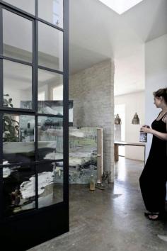 
                    
                        An artist's home in black, white and concrete
                    
                