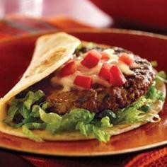 
                        
                            Fiesta Burgers Con Queso - This is a new twist on a Mexican burger.  I like the idea of serving it on a thick tortilla for a lighter meal.  I would make the salsa and the guacamole from scratch to make it better.
                        
                    