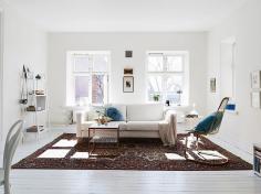 
                    
                        A Swedish apartment in pretty white, blue and cognac
                    
                