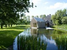 
                    
                        moat house in belgium, lush and green
                    
                