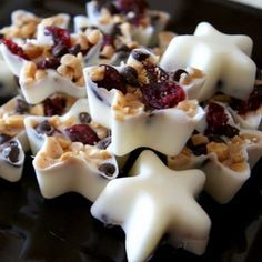 Bite-size chocolate bark ~melted white chocolate, sweet cranberries, toffee & dark chocolate chips in ice cube trays or candy trays. Great idea!!