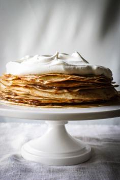 Bananas Foster Crepe Cake topped with a Bourbon Whipped Cream