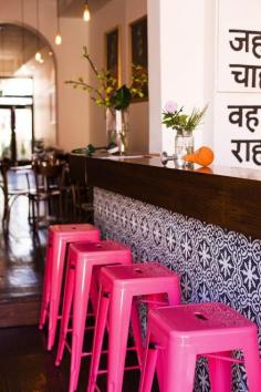 
                    
                        Hot pink stools and the best bar tile!
                    
                