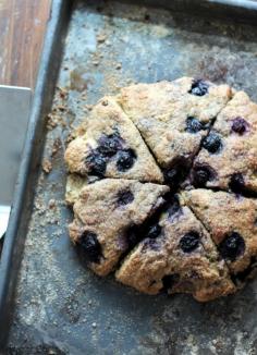 Healthy scones made with whole wheat flour, greek yogurt, and blueberries.  I used dried cranberries and the zest and juice of one orange instead of blueberries.
