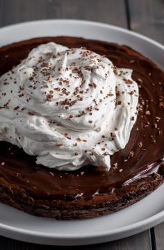 
                    
                        Flourless Brownie Tart with Dark Chocolate Glaze and Whipped Coconut Cream
                    
                