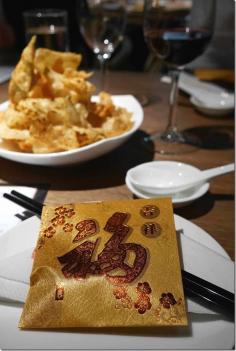 
                    
                        A gold envelop emblazoned with the Chinese character ‘fook’ (meaning prosperity in Cantonese) contains a miniature gold sycee, an item used by ancient Chinese as early as the Qin Dynasty as a medium for barter and exchange.
                    
                
