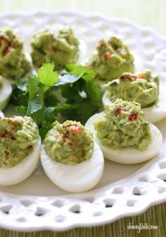 Guacamole Deviled Eggs- with easter right around the corner and lots of boiled eggs, I thought this looked yummy