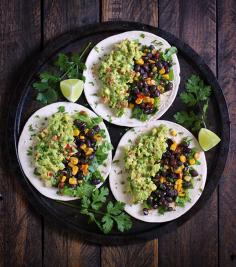 Loaded Guacamole Vegetarian Tacos. Veggie-loaded guacamole tacos with black beans, corn, and peppers. Full-on delish (vegan, too).