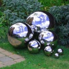 mirrored gazing balls garden Three gazing balls from the store? $120. Three unbreakable gazing balls from TGG’s Diy Projects? $25 I would just spray paint bouncy balls