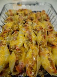 
                    
                        Mexican Stuffed Shells.  Look soooo good. Made with ground beef, taco seasoning, cream cheese, jumbo pasta shells, Monterey and cheddar cheeses and a few other ingredients.  This would make a wonderful weeknight dinner with a side salad. Make two trays, because it's a great freezer meal too.   dessertationblog....
                    
                