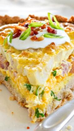 
                    
                        Loaded Potato Quiche ~ It’s absolutely packed with flavor. The filling is made from hash browns, savory ham, sharp Cheddar cheese, green onions, eggs, and perfectly crispy bacon... Made easy with a quick Bisquick crust!
                    
                