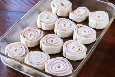 
                    
                        Hot Ham & Cheese Roll-Ups with a Brown Sugar Poppy Seed Glaze. Perfect for taking to friends, new moms, and family because you can assemble it the night before and bake it the next day.
                    
                