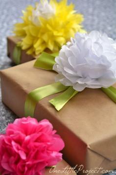 
                    
                        Gift wrapping with tissue paper flowers is a simple way to wrap gifts, but it looks so beautiful!  This would be perfect for Mother's Day!
                    
                