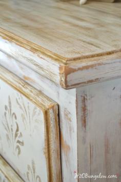 
                    
                        Heavily-distressed-white-and-gold-damask-stenciled-dresser-H2OBungalow
                    
                