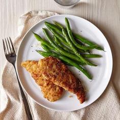 
                    
                        These kid-friendly chicken fingers cut out some of the fat by being cooked mostly in the oven.
                    
                