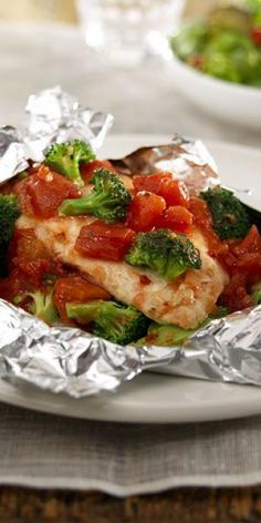 Easy dinner.. Chicken breast, broccoli and diced tomatoes seasoned with Italian dressing -- cooked together in foil packets for an easy entrée