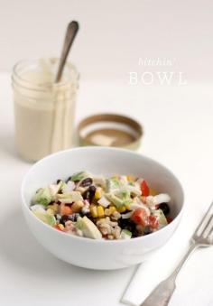 Bitchin' Bowl - a Salad with brown rice, corn, black beans, avocado, tomato and onion and served with Bitchin' Sauce