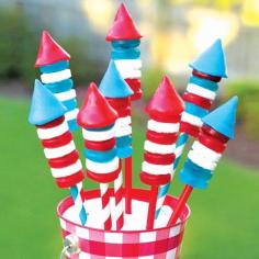 Candy bottle rockets filled with Pop Rocks will make an interactive & edible July 4th centerpiece - with plenty of TNT for your mouth!