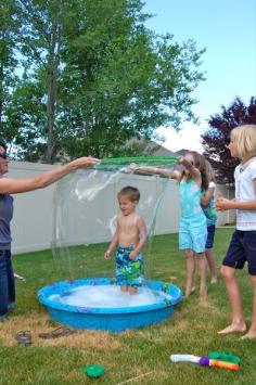 Giant bubbles in a kiddie pool, ultimate summer fun!