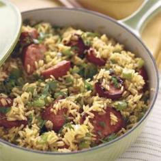 
                    
                        Skillet Sausage 'n' Rice
1 (16-oz.) package smoked sausage
1 medium-size green bell pepper, chopped $
1 small onion, chopped $
1 garlic clove, minced $
1 cup chicken broth $
2 (3.5-oz.) bags quick-cooking brown rice $
1/2 teaspoon salt $
1/4 teaspoon pepper $
Garnish: chopped fresh parsley
                    
                