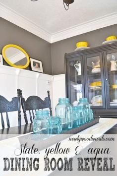 Blue jars grouped together as a centerpiece. {A dining room tour in lovely slate, yellow and aqua - you have to see  the ugly before photos (red and green walls and layers of bad tile).}