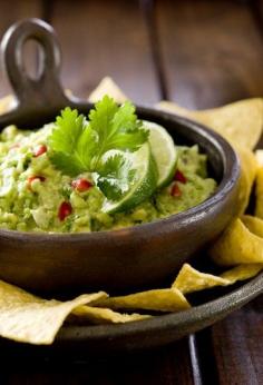 
                    
                        Authentic Mexican Guacamole Recipe! Just 130 calories for 1/2 cup of deliciousness. Close Up with Tortilla Chips
                    
                