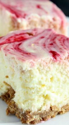 Lemon Raspberry Cheesecake Squares ~ A smooth and creamy lemon cheesecake with a raspberry swirl topped on a homemade graham cracker crust. #cheesecake #recipie