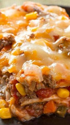 
                    
                        Layered Burrito Bake ~ Ground beef, salsa, refried beans and cheese are layered between tortillas for a burrito bake that's like a fiesta in a dish.
                    
                