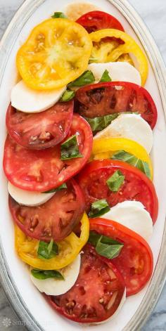 Heirloom Tomato Basil Mozzarella Salad ~ Heirloom tomato, basil, Mozzarella salad made with beautiful, ripe heirloom tomatoes.  Classic Italian Caprese salad recipe. #MemorialDay ~ SimplyRecipes.com