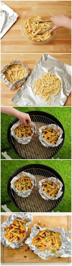 Grilled Foil-Pack Cheesy Fries - Frozen French fries work great on the grill! These grilled cheesy fries go from frozen to table in a flash! Camping food?