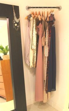 Add a corner rod for planning outfits or what to wear the next day. Clever for those wasted corner spaces. Also good idea to create a "closet" space in a guest room.