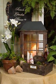 Tabletop Greenhouses this year. Perfect with a few white pillar candles, this is a great welcome~to~our~home display. Here they are by the FrenchGardenHouse, above, by the front door they are on an antique bench.