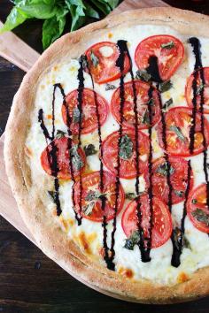 Caprese Pizza Recipe on twopeasandtheirpod.com Love this classic pizza! #pizza