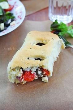 Flavorful olive oil bread filled with tomatoes, onion, olives and feta cheese making a delicious weeknight dinner - and links to lots of other bread recipes