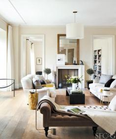 
                    
                        Neutral living room with wood stump side table
                    
                