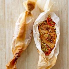 Ginger-Soy Red Snapper en Papillote. An Asian-inspired marinade amps up the flavor of red snapper, which is cooked in a parchment-paper packet along with carrots and napa cabbage. Use parchment paper and do this in your oven or use foil and do this on your grill! #fish #recipes