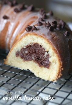 Fudge Filled Vanilla Bundt Cake - This Fudge Filled Vanilla Bundt Cake recipe is buttery and moist with a super fudgy cream cheese filling inside!