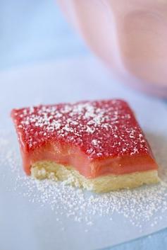 Full Gaps - Rhubarb Bars 400 grams rhubarb (about 10 to 15 stalks) 1/3 cup sugar 6 egg yolks 3/4 cup sugar   a pinch of salt 1 teaspoon lemon zest (optional) 50 grams unsalted butter, cut up into chunks 4 ounces butter, room temperature 1 cup (136 grams) all-purpose flour 1/4 cup sugar a pinch of salt about 1/2 of the Rhubarb curd recipe from above Powdered sugar for dusting (optional)