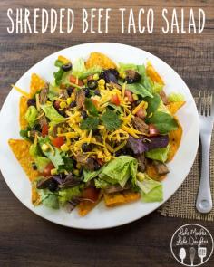 shredded beef taco salad - For an easy dinner idea that the whole family will love, you have got to try this delicious shredded beef taco salad! The beef is cooked in the slow cooker so its flavorful and tender. You can top your salad with your favorite toppings so everyone will be happy with the meal!