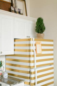 Gold stripes- good DIY idea to cover up an ugly white fridge