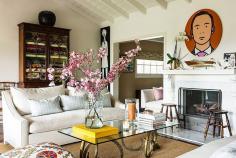 
                    
                        The sitting room is an airer take on New England style. DeKwiatkowski topped a pair of stylized ram’s heads with glass to make the coffee table, while a piece by British artist Julian Opie hangs over the mantel. #refinery29 www.refinery29.co...
                    
                