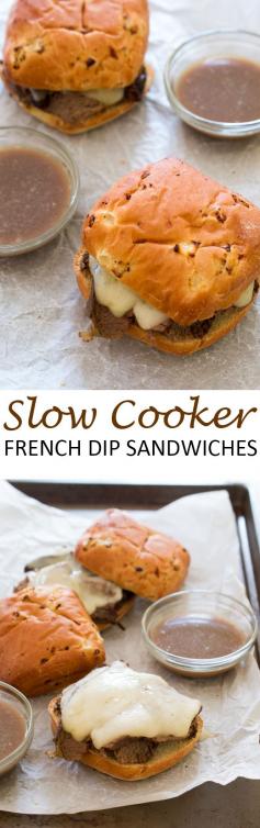 Slow Cooker French Dip Sandwiches. Tender pot roast cooked low and slow and served on crusty bread with provolone cheese. A super easy make ahead meal! | chefsavvy.com