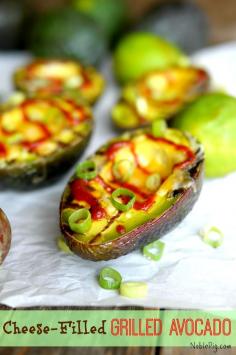Cheese Filled Grilled Avocados from Noble Pig a perfect appetizer      2 California avocados, halved and pitted     juice of one lime     4 heaping Tablespoons finely shredded cheese (I used a Mexican blend)     salt and pepper to taste     2 Tablespoons finely chopped green onion