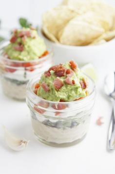 Skinny Guacamole Layered Dip - Make this skinny recipe without losing flavor by using Joan of Arc beans | joanofarc.com #dips #skinny #recipe #protein